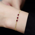 925 sterling silver 14K gold finish - triple red garnet zirconia bracelet
